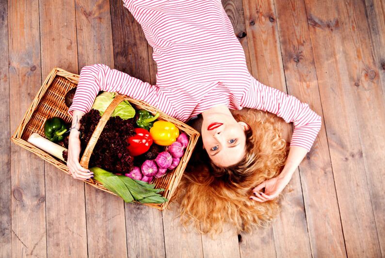 A girl with a basket of vegetables
